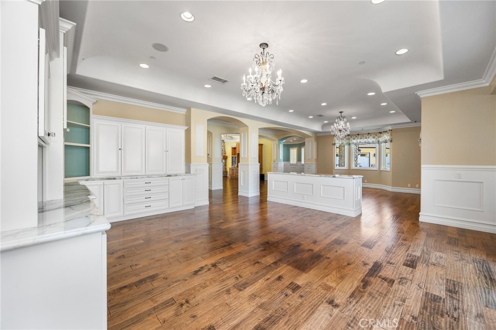 1450 North Nicky Way Orange, CA 92869 - Photo 20 of 64 a view of a big room with wooden floor and a kitchen