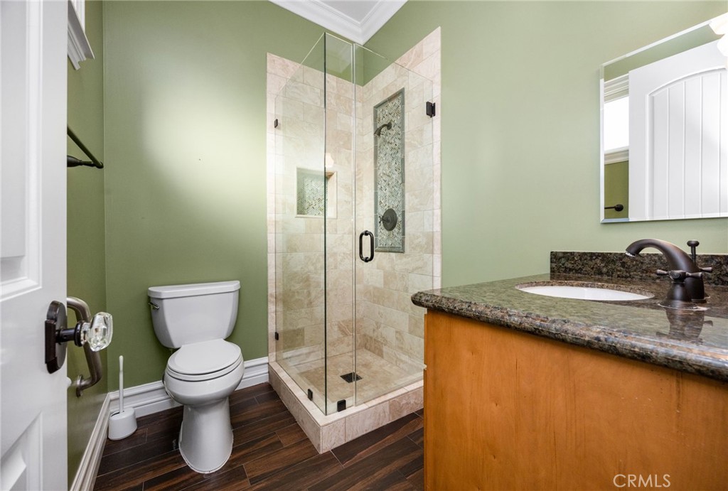 1450 North Nicky Way Orange, CA 92869 - Photo 42 of 64 a bathroom with a granite countertop toilet sink and shower
