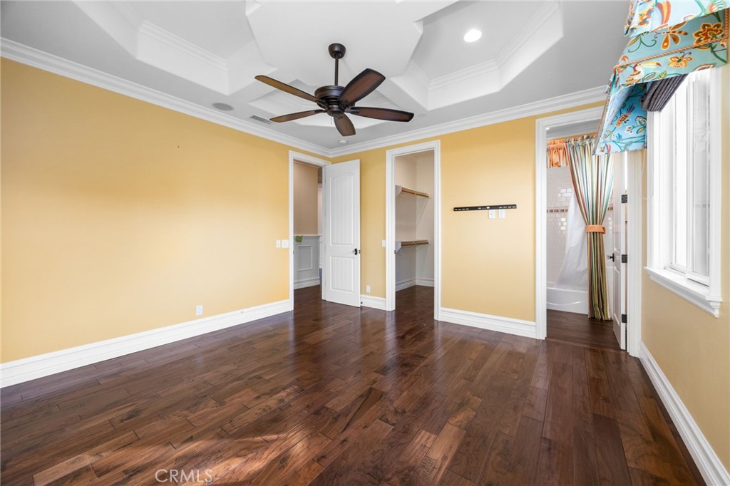 1450 North Nicky Way Orange, CA 92869 - Photo 44 of 64 a view of an empty room with wooden floor and a window