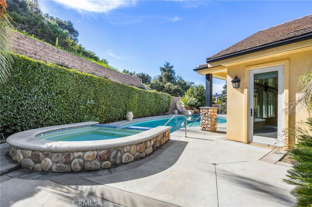 1450 North Nicky Way Orange, CA 92869 - Photo 49 of 64 a view of a swimming pool with a patio