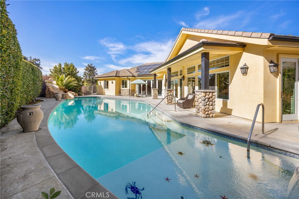 1450 North Nicky Way Orange, CA 92869 - Photo 51 of 64 a view of a house with a swimming pool