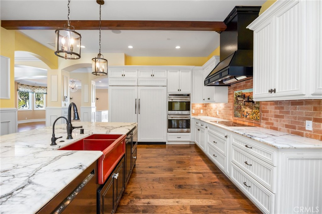 1450 North Nicky Way Orange, CA 92869 - Photo 10 of 64 a kitchen with stainless steel appliances granite countertop a sink a stove and a wooden floors