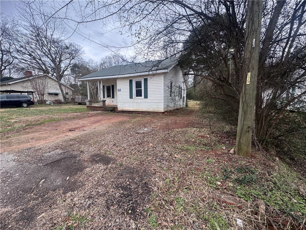32 Ames Street Seneca, SC 29678 - Photo 13 of 14 This charming home offers a quiet setting with ample outdoor space and classic appeal.