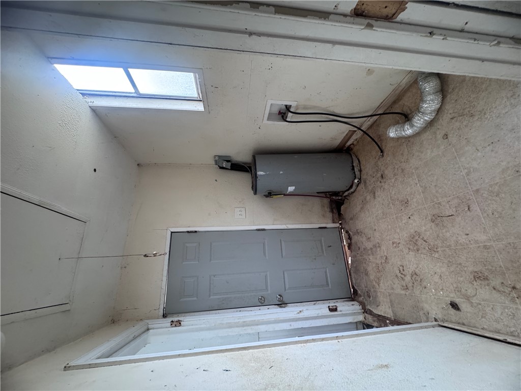 32 Ames Street Seneca, SC 29678 - Photo 6 of 14 This functional utility room offers essential amenities for daily living.