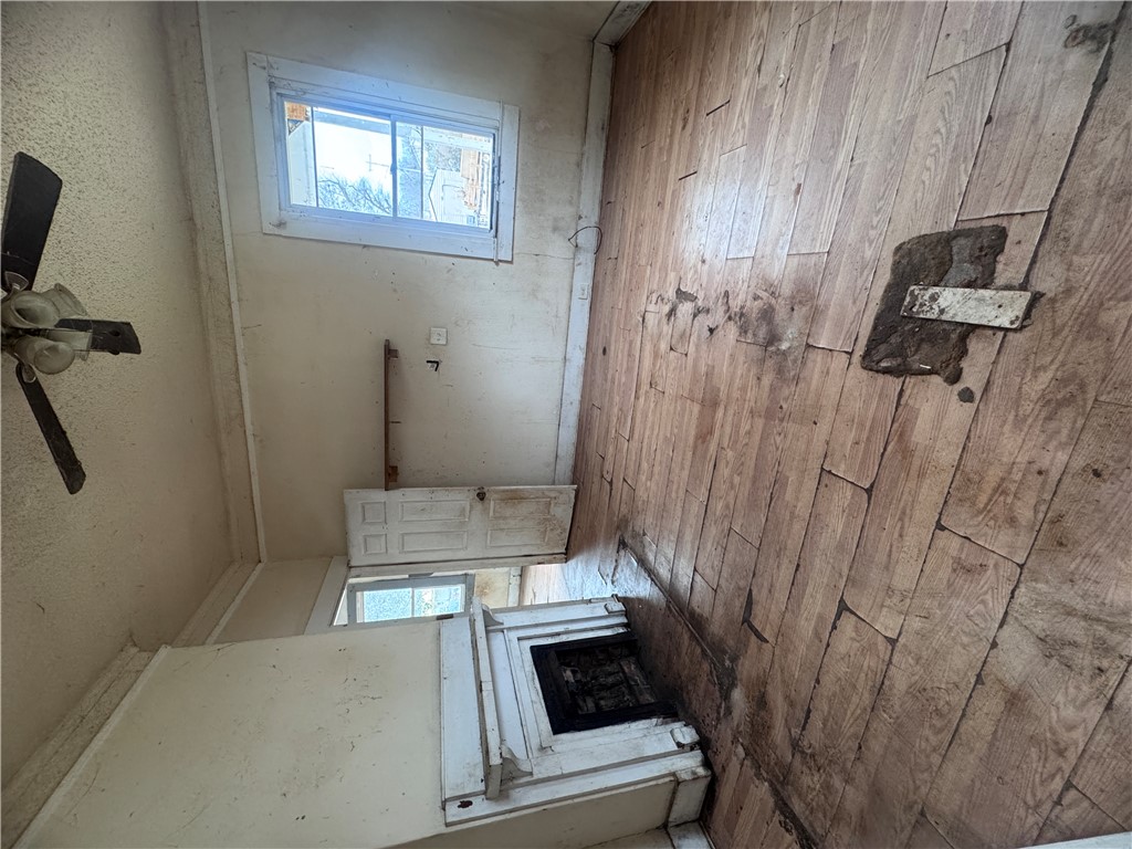 32 Ames Street Seneca, SC 29678 - Photo 10 of 14 This interior offers a glimpse of a room with natural light and classic hardwood floors.