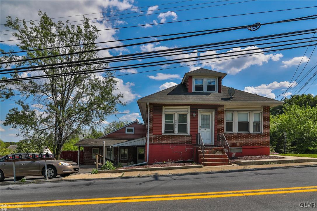 5562 Main Street Whitehall, PA 18052 - Photo 1 of 50 a front view of a house with a yard