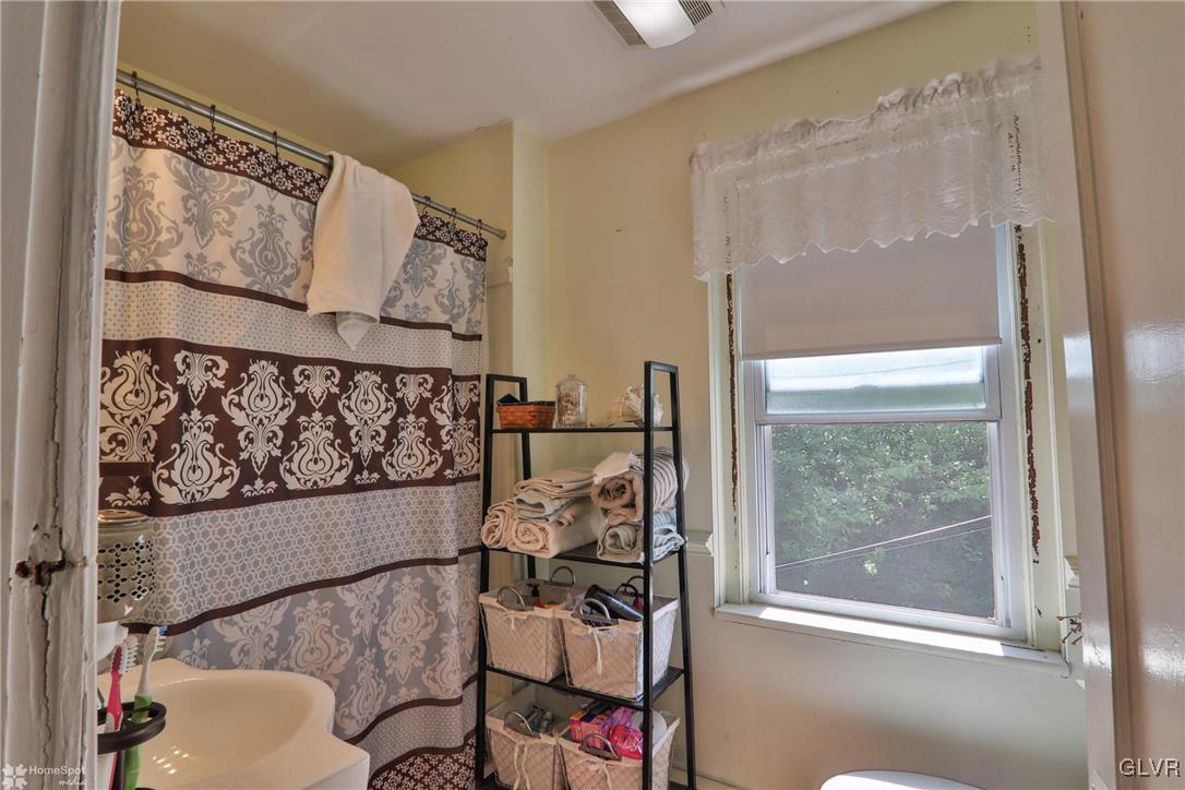 5562 Main Street Whitehall, PA 18052 - Photo 12 of 50 a view of a living room and bathroom