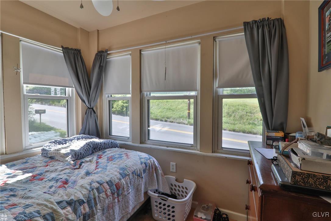 5562 Main Street Whitehall, PA 18052 - Photo 16 of 50 a bedroom with a bed closet and a large window