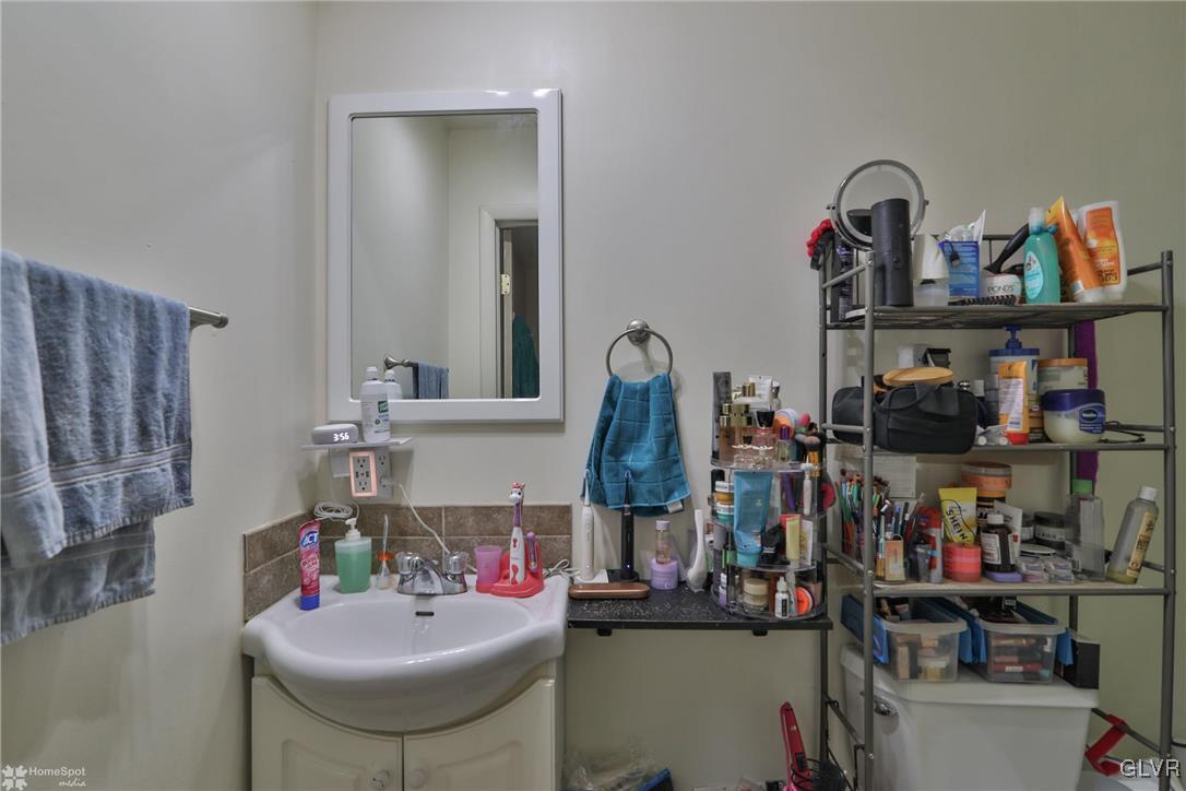 5562 Main Street Whitehall, PA 18052 - Photo 20 of 50 a bathroom with a sink and a mirror