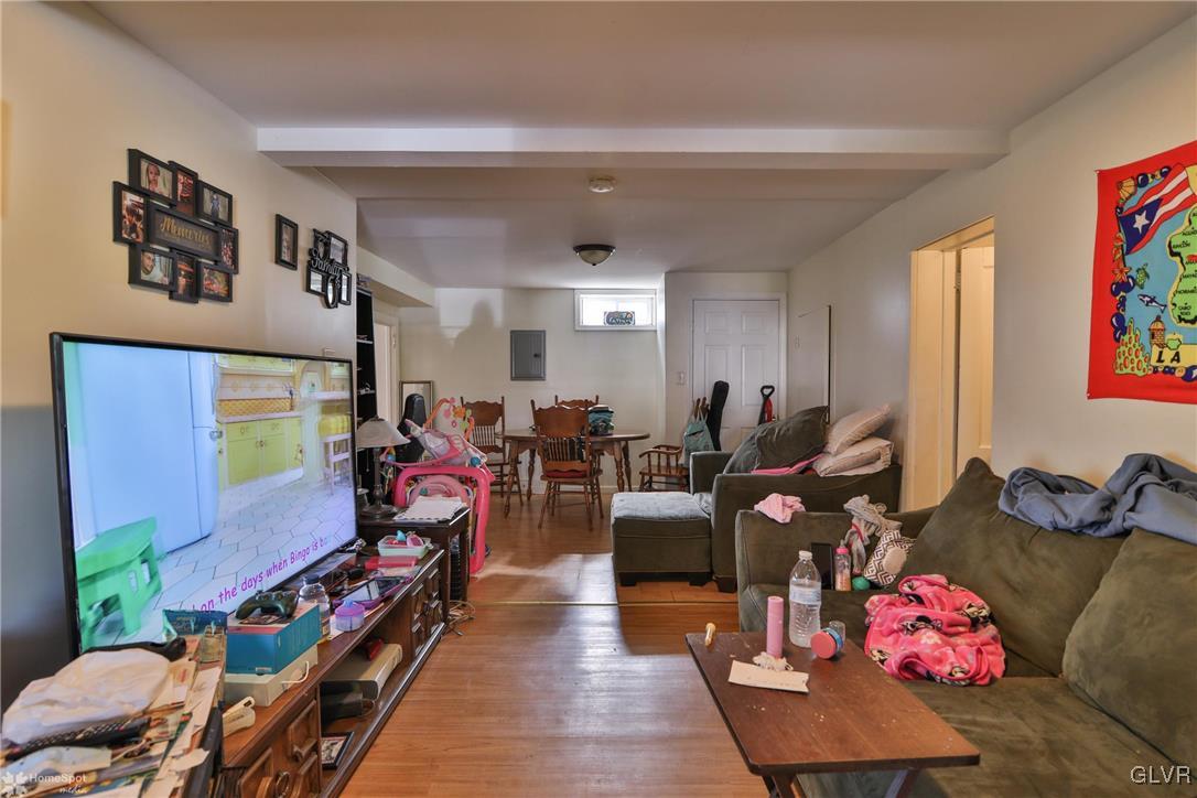 5562 Main Street Whitehall, PA 18052 - Photo 25 of 50 a living room with lots of furniture and wooden floor