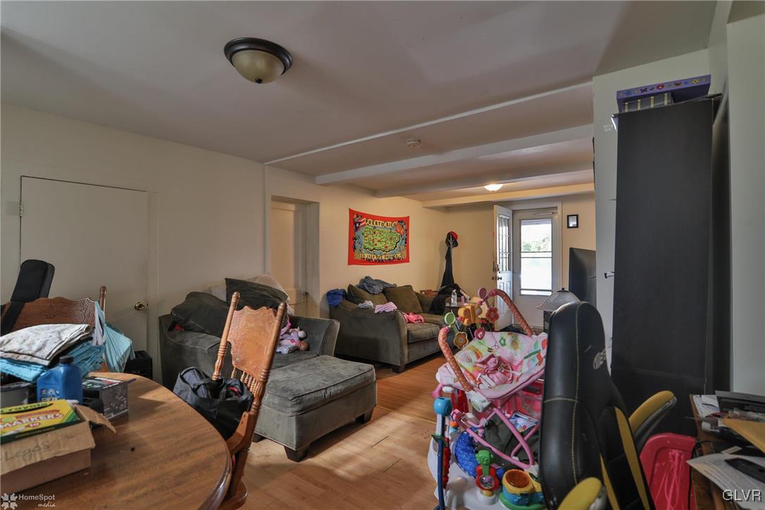 5562 Main Street Whitehall, PA 18052 - Photo 27 of 50 a living room with furniture and a mirror