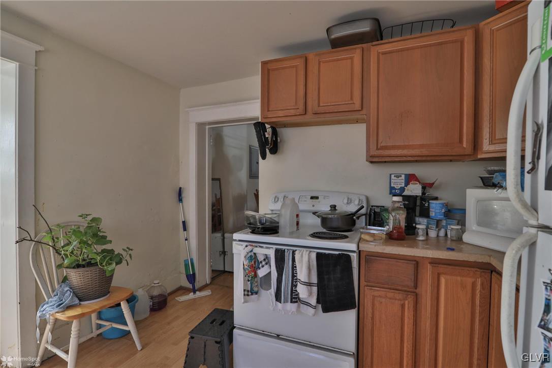 5562 Main Street Whitehall, PA 18052 - Photo 29 of 50 a kitchen with stainless steel appliances granite countertop a sink stove and cabinets