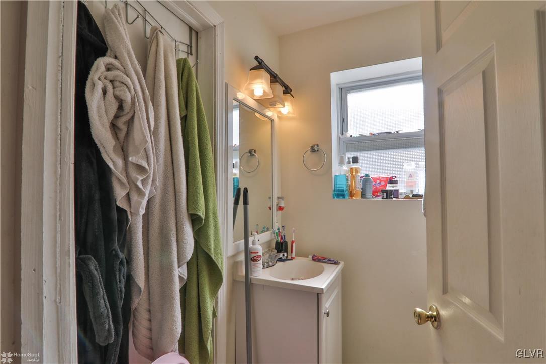 5562 Main Street Whitehall, PA 18052 - Photo 30 of 50 a bathroom with a sink and a mirror