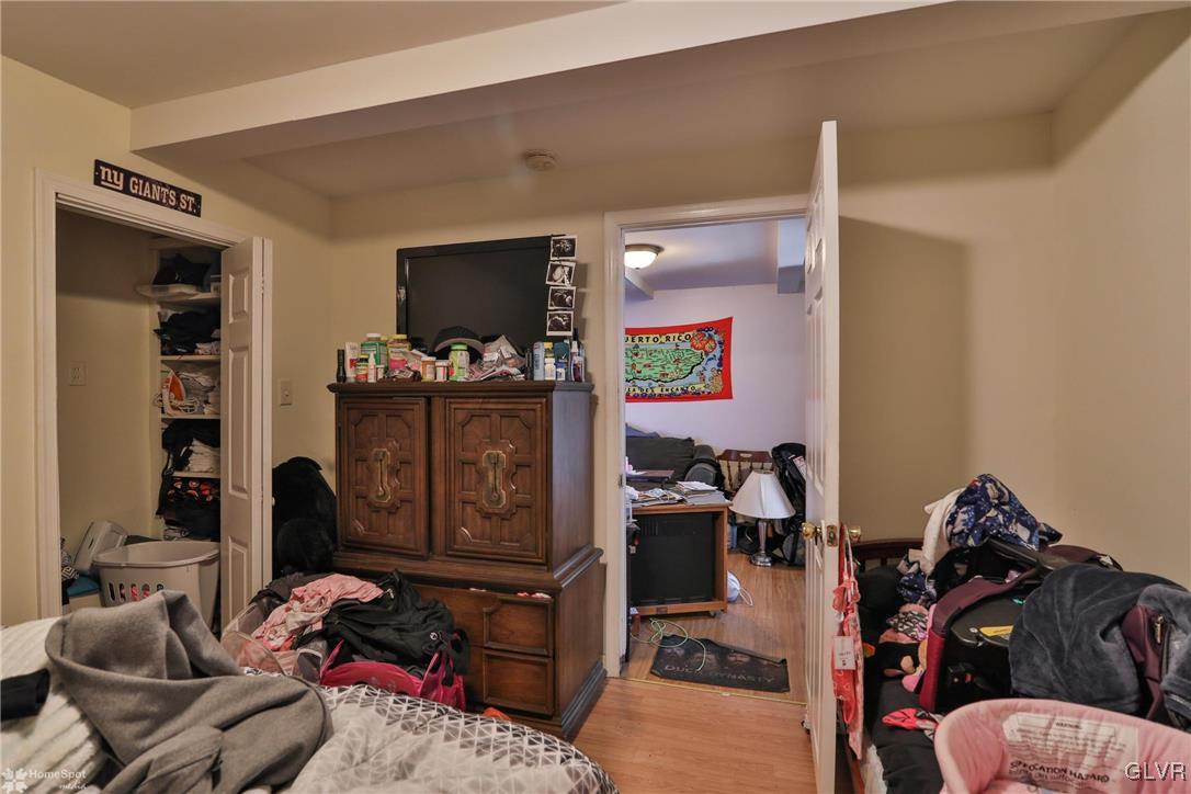 5562 Main Street Whitehall, PA 18052 - Photo 33 of 50 a room with furniture closet and a flat screen tv