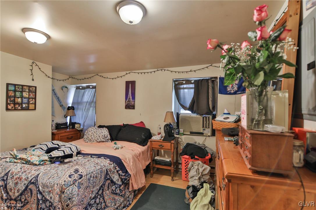 5562 Main Street Whitehall, PA 18052 - Photo 40 of 50 a bedroom with bed and a potted plant