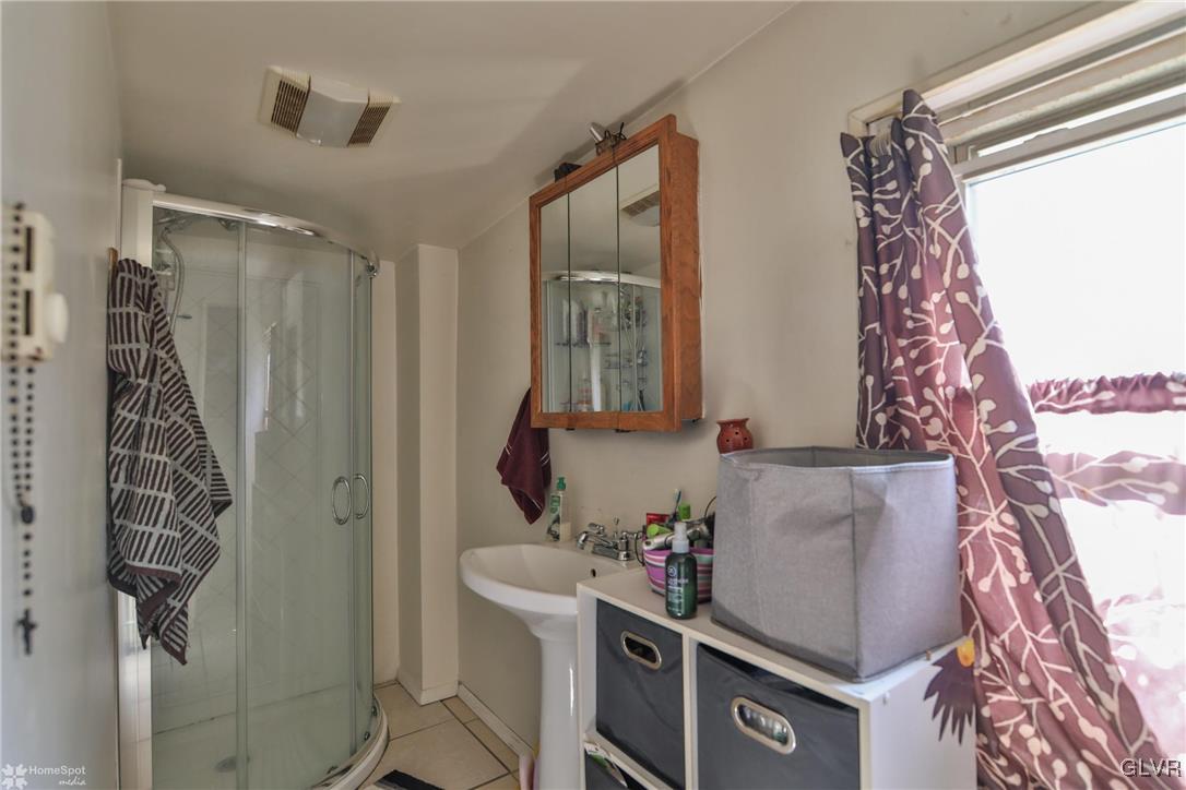 5562 Main Street Whitehall, PA 18052 - Photo 41 of 50 a bathroom with a bathtub and shower