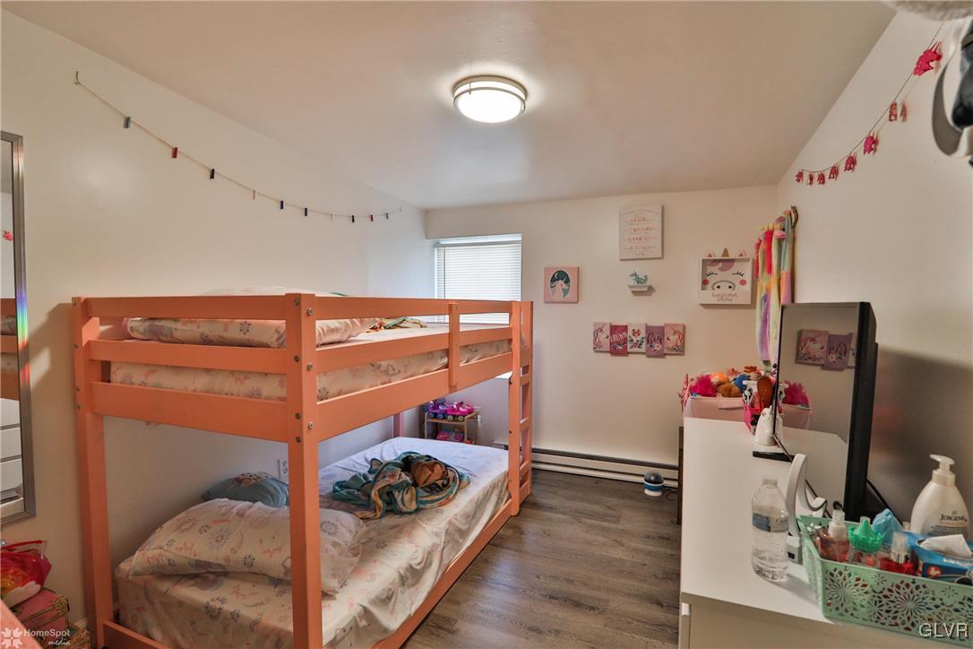 5562 Main Street Whitehall, PA 18052 - Photo 46 of 50 a view of a room that has a bed and a flat tv screen on the wall