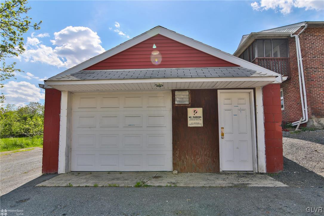 5562 Main Street Whitehall, PA 18052 - Photo 50 of 50 a front view of a house with a garage