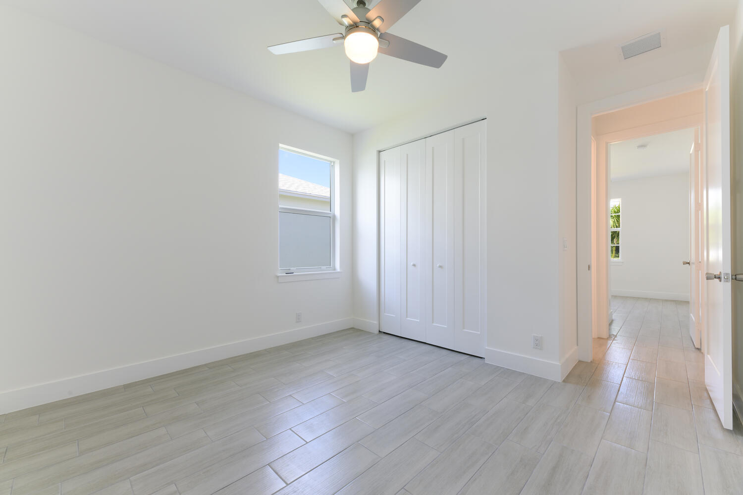 18058 Limestone Creek Road Jupiter, FL 33458 - Photo 11 of 30 a view of an empty room with wooden floor