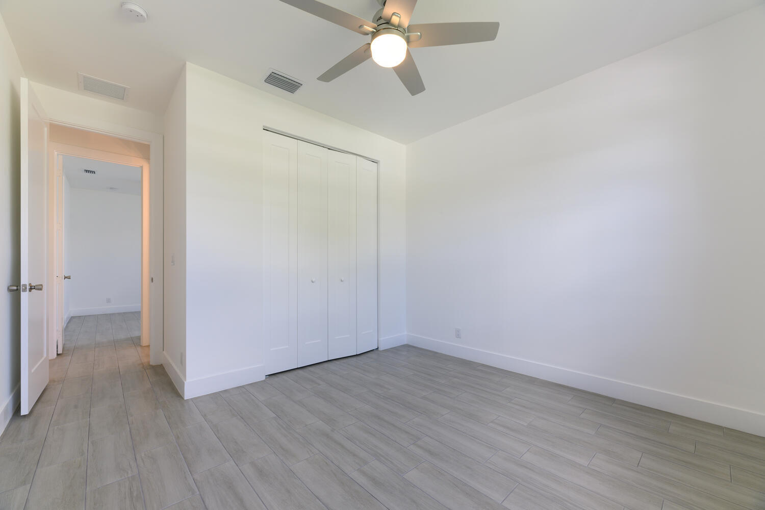 18058 Limestone Creek Road Jupiter, FL 33458 - Photo 19 of 30 wooden floor in an empty room