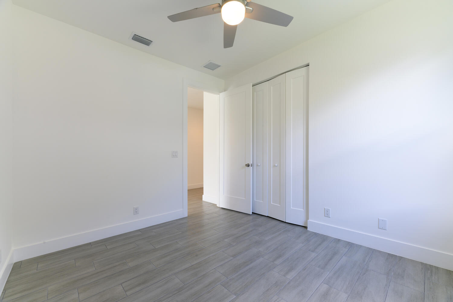 18058 Limestone Creek Road Jupiter, FL 33458 - Photo 23 of 30 a view of an empty room with wooden floor