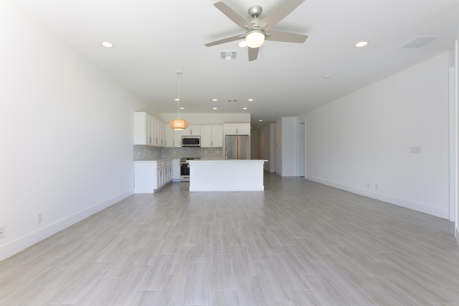 18058 Limestone Creek Road Jupiter, FL 33458 - Photo 10 of 30 a view of a kitchen with a sink and a chandelier fan