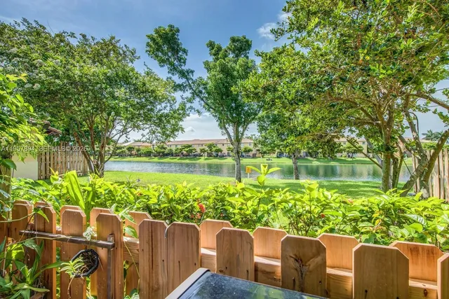 a view of a chair and table in the garden