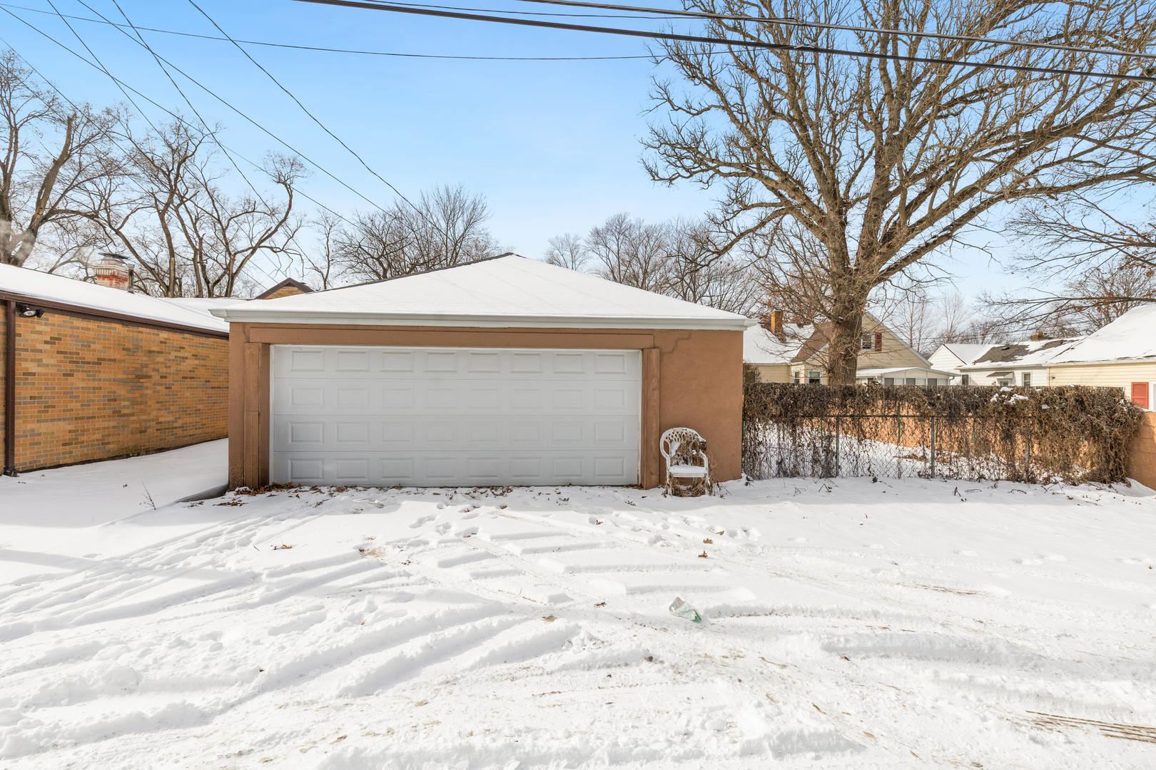580 Enos Avenue Kankakee, IL 60901 - Photo 20 of 22 a house with a yard covered with snow in front of house