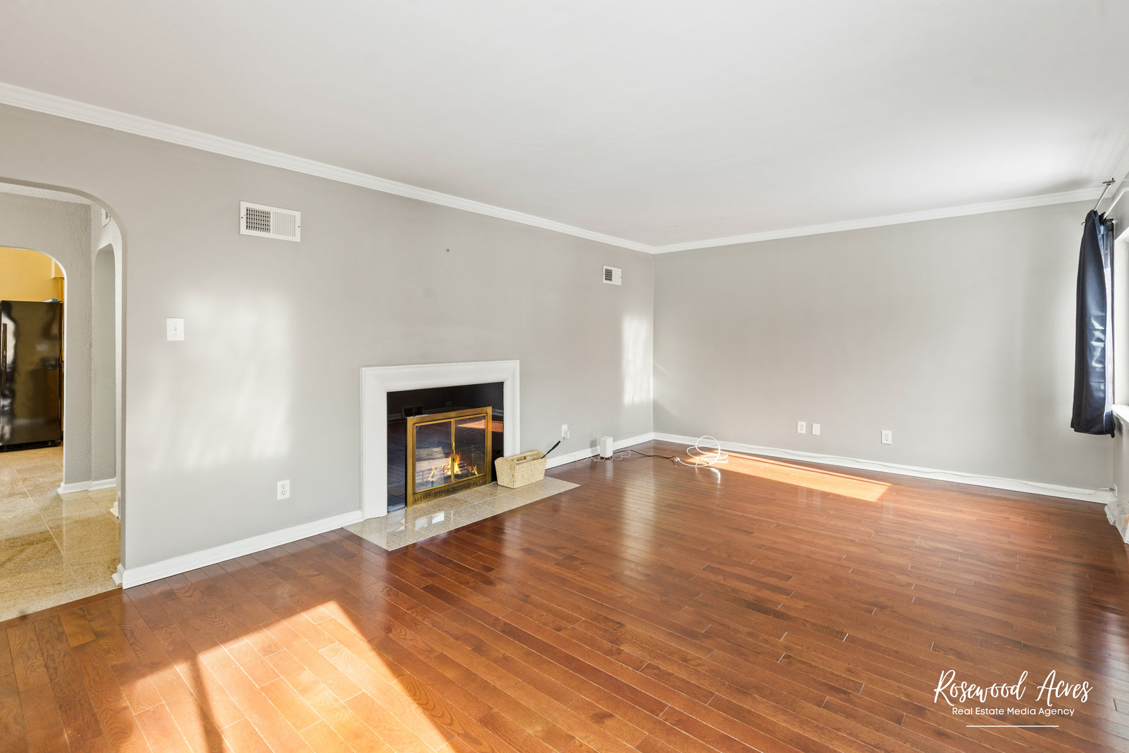 580 Enos Avenue Kankakee, IL 60901 - Photo 5 of 22 a view of empty room with wooden floor and fireplace