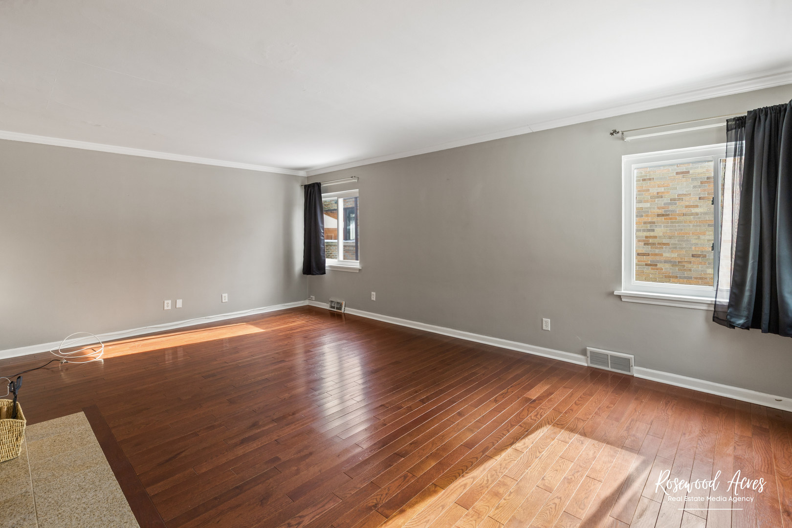 580 Enos Avenue Kankakee, IL 60901 - Photo 7 of 22 an empty room with wooden floor and windows