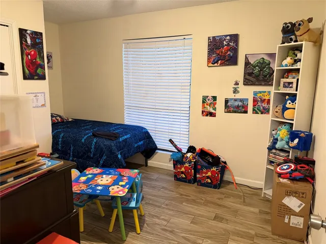 a view of a workspace with furniture and toys