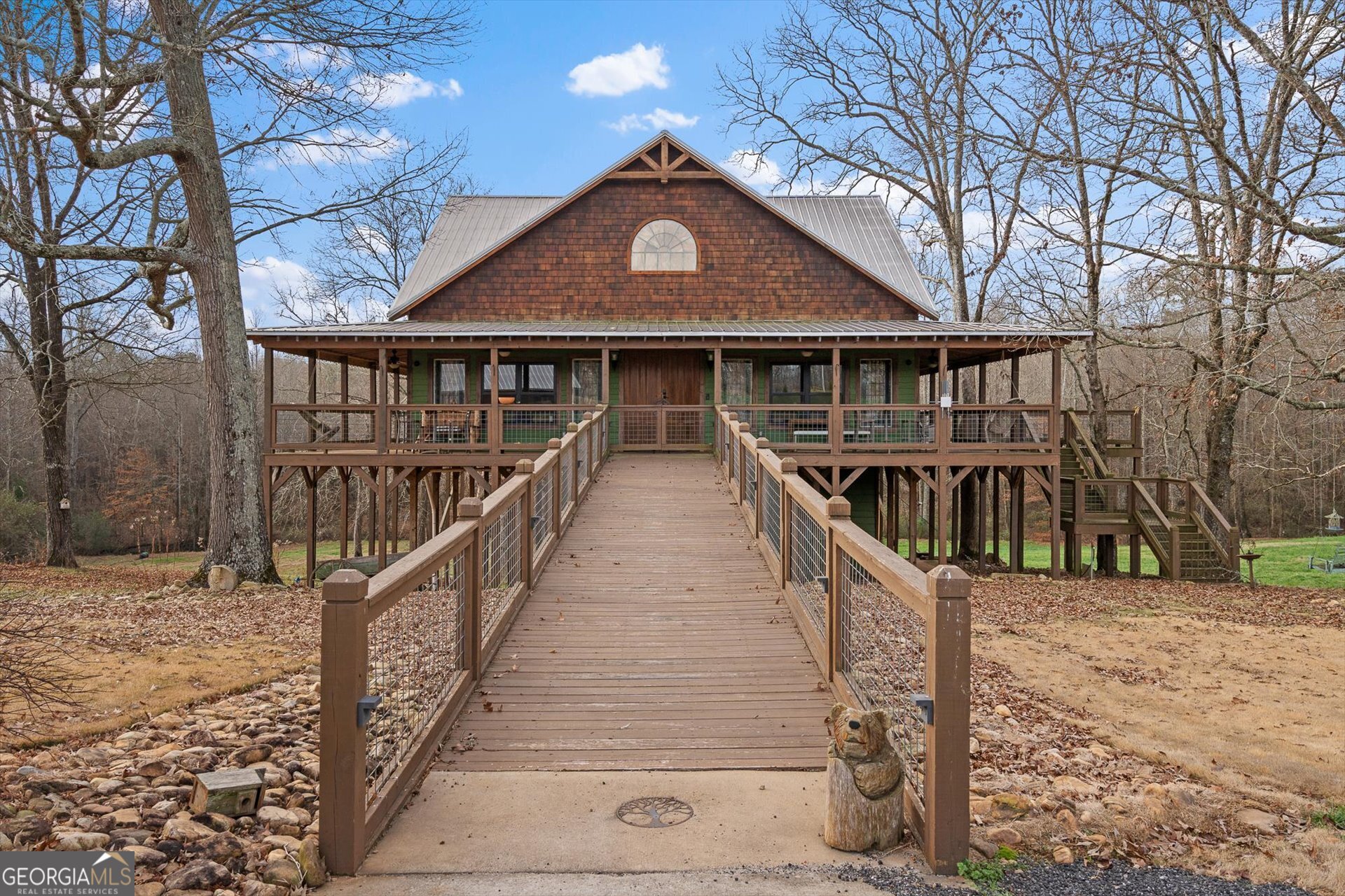 a front view of a house with wooden fence