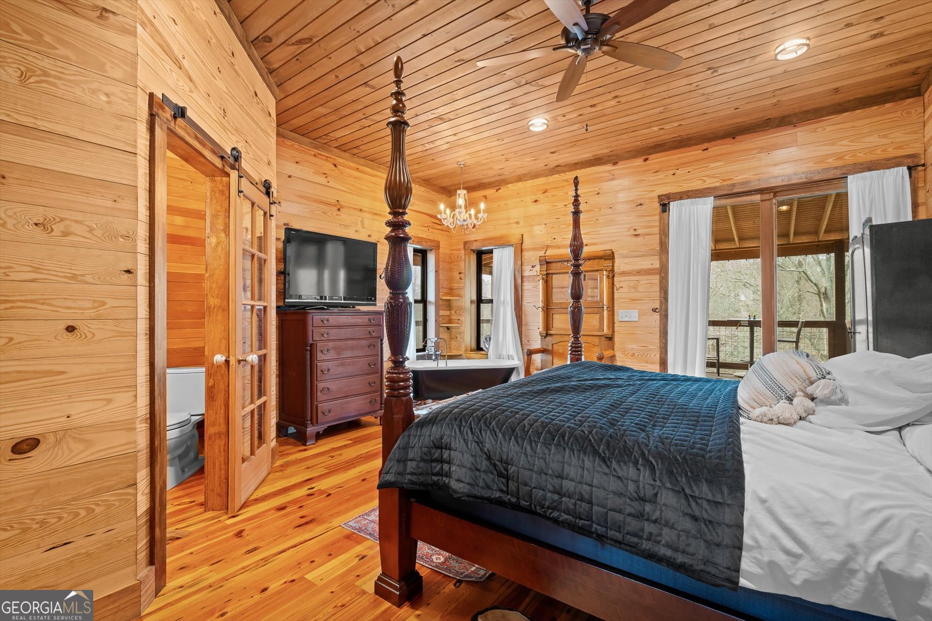 976 Salem Church Road Carrollton, GA 30117 - Photo 26 of 55 a bedroom with a bed next to a window