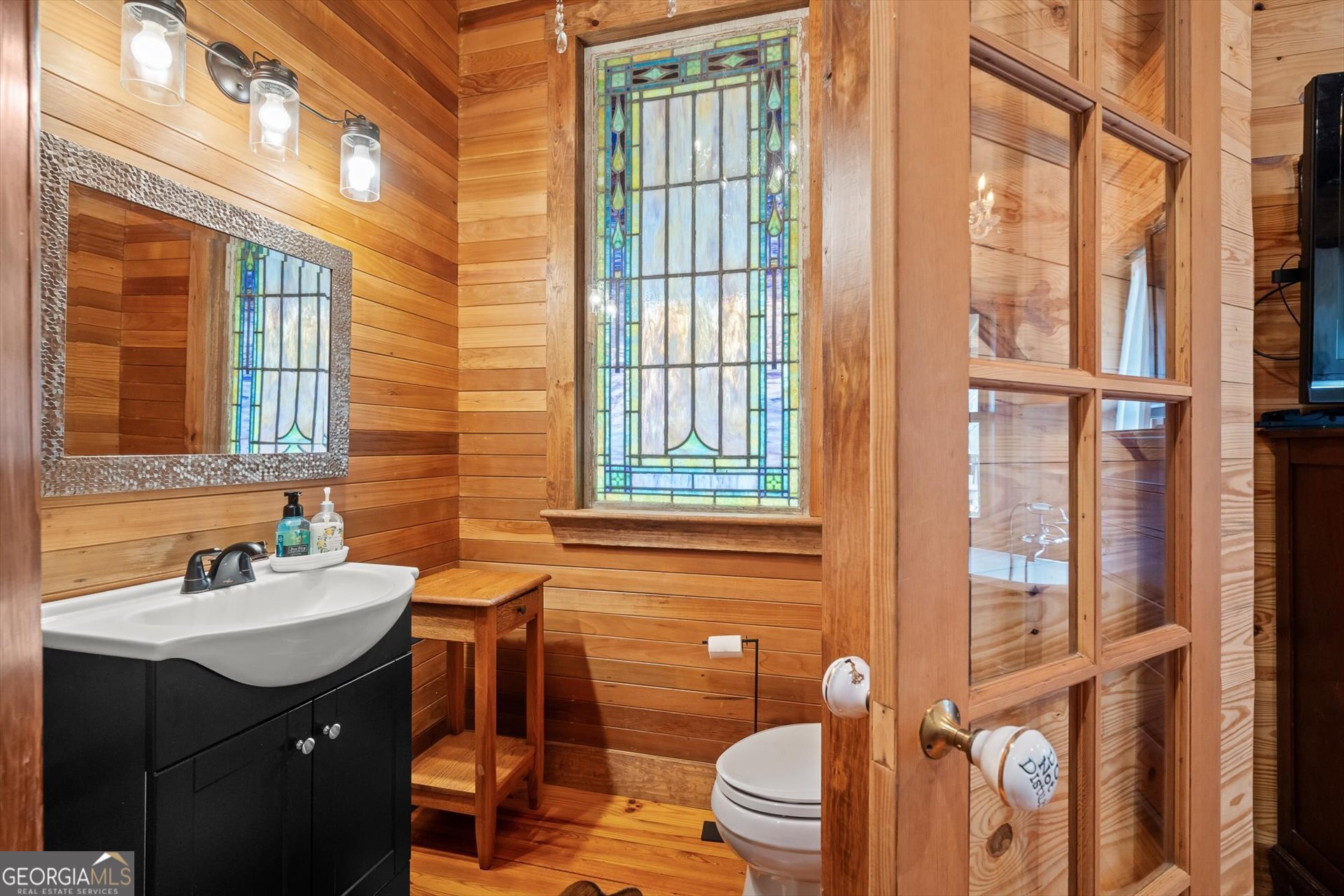 976 Salem Church Road Carrollton, GA 30117 - Photo 30 of 55 a bathroom with a sink a toilet and a window