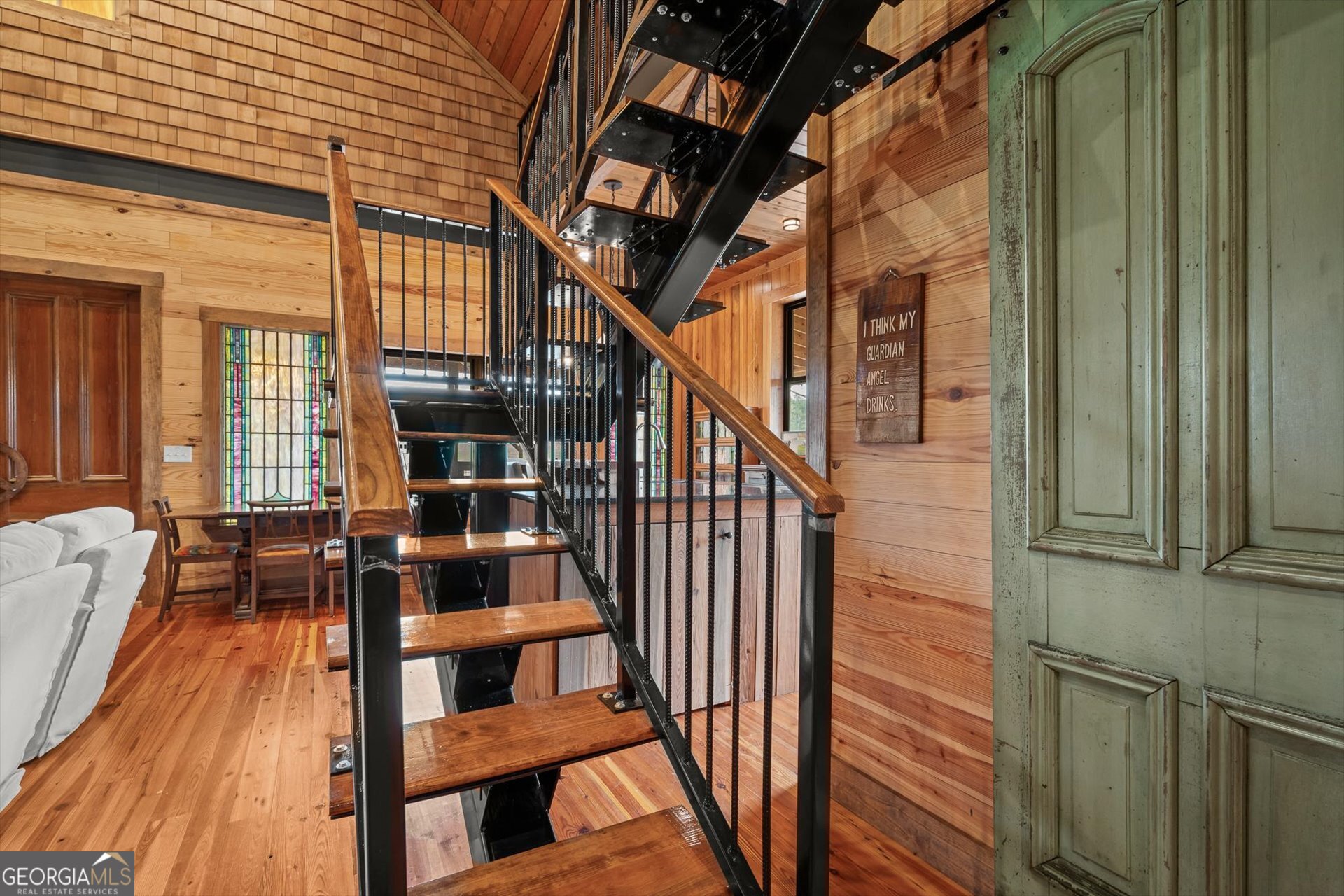 976 Salem Church Road Carrollton, GA 30117 - Photo 31 of 55 a view of staircase with wooden floor and chair