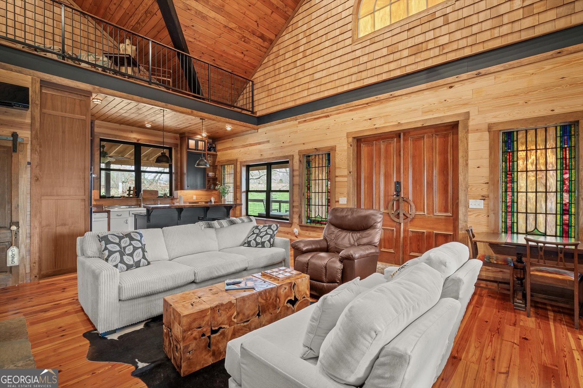 976 Salem Church Road Carrollton, GA 30117 - Photo 5 of 55 a living room with furniture and floor to ceiling windows