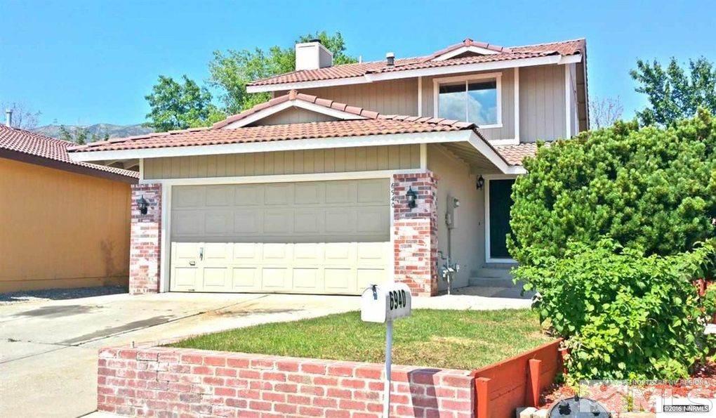 6940 Flower Street Reno, NV 89506 - Photo 1 of 20 a front view of a house with garden