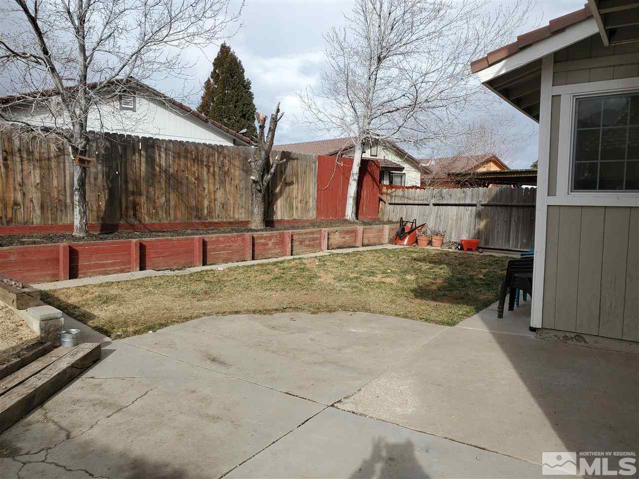 6940 Flower Street Reno, NV 89506 - Photo 16 of 20 a view of a house with snow on the road