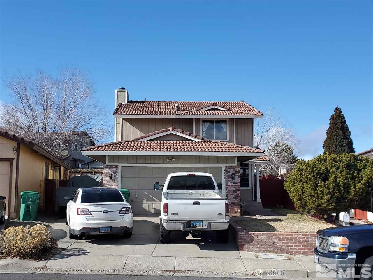6940 Flower Street Reno, NV 89506 - Photo 2 of 20 a car parked in front of a house
