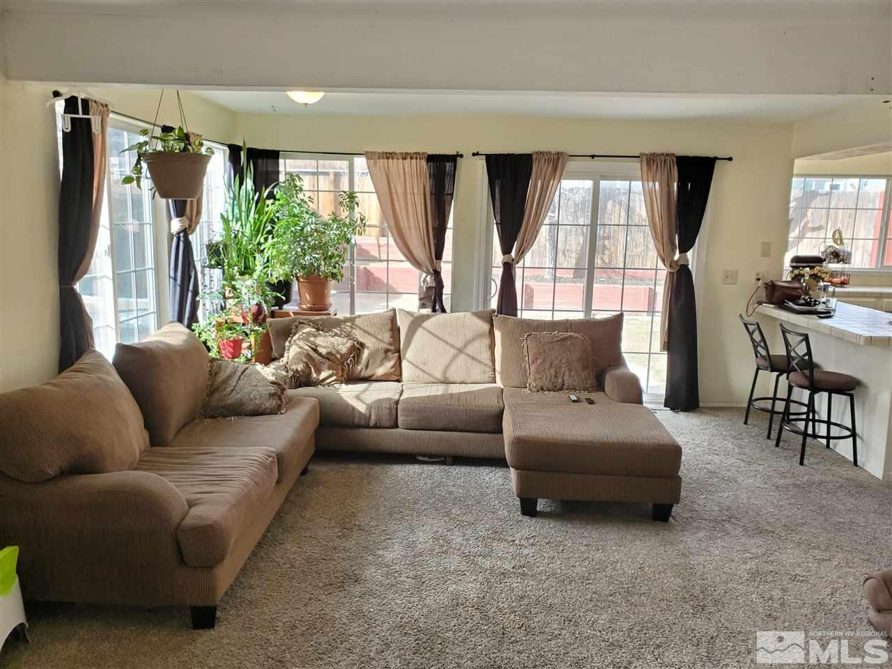 6940 Flower Street Reno, NV 89506 - Photo 4 of 20 a living room with furniture and a large window