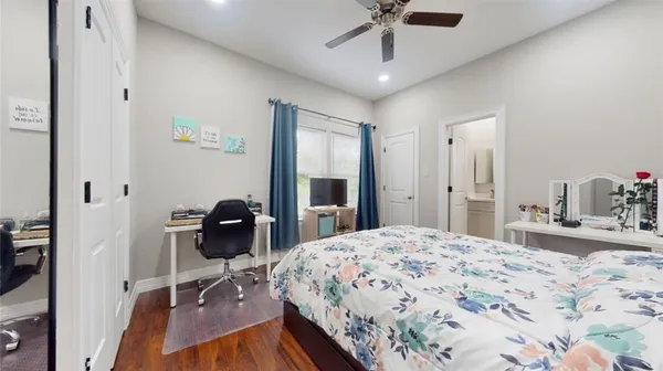 a bedroom with a bed and a table