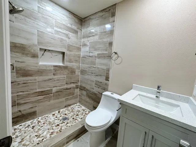 a bathroom with a sink and toilet