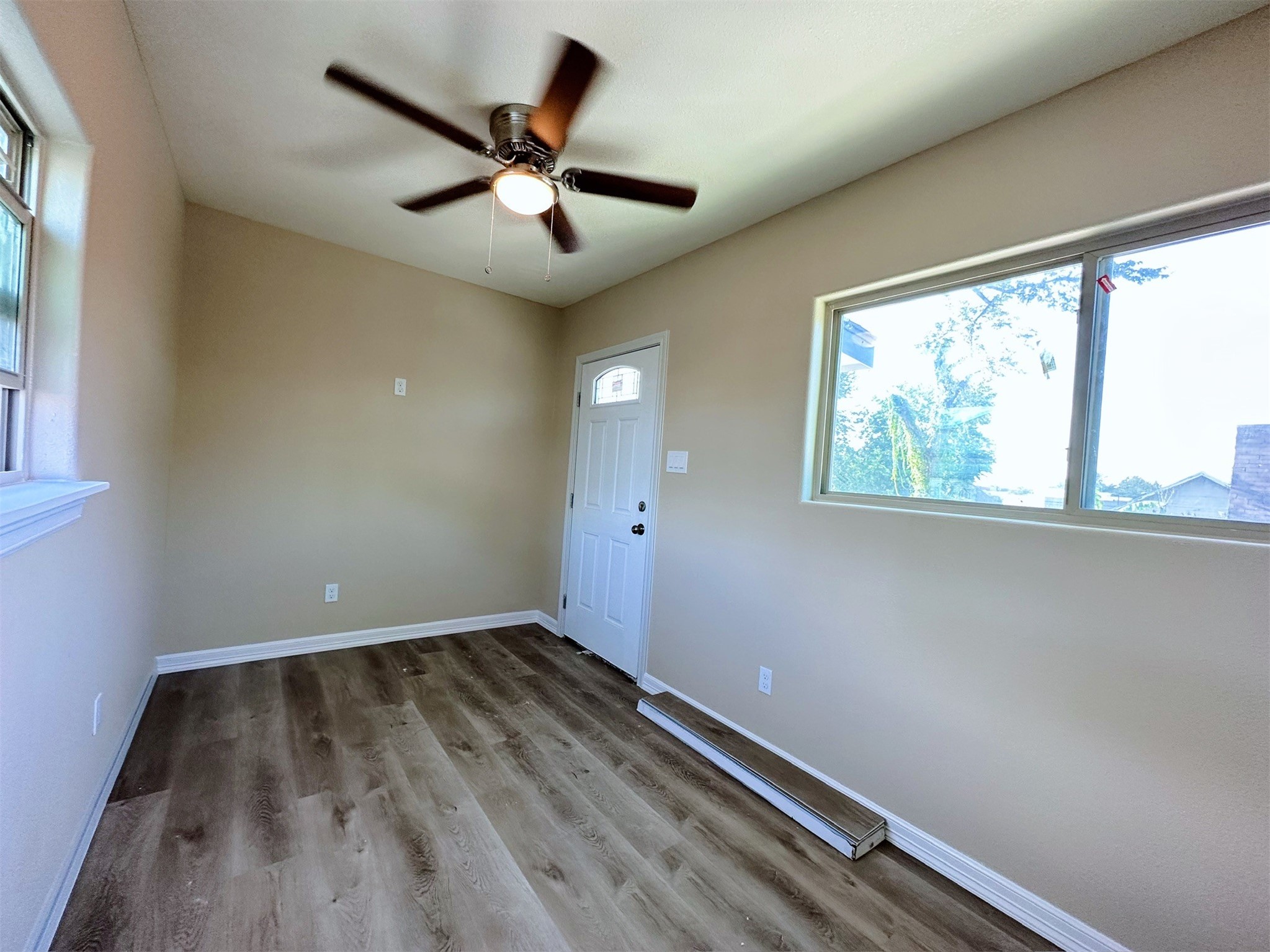 426 Middle Street Houston, TX 77003 - Photo 38 of 38 wooden floor in an empty room with a window