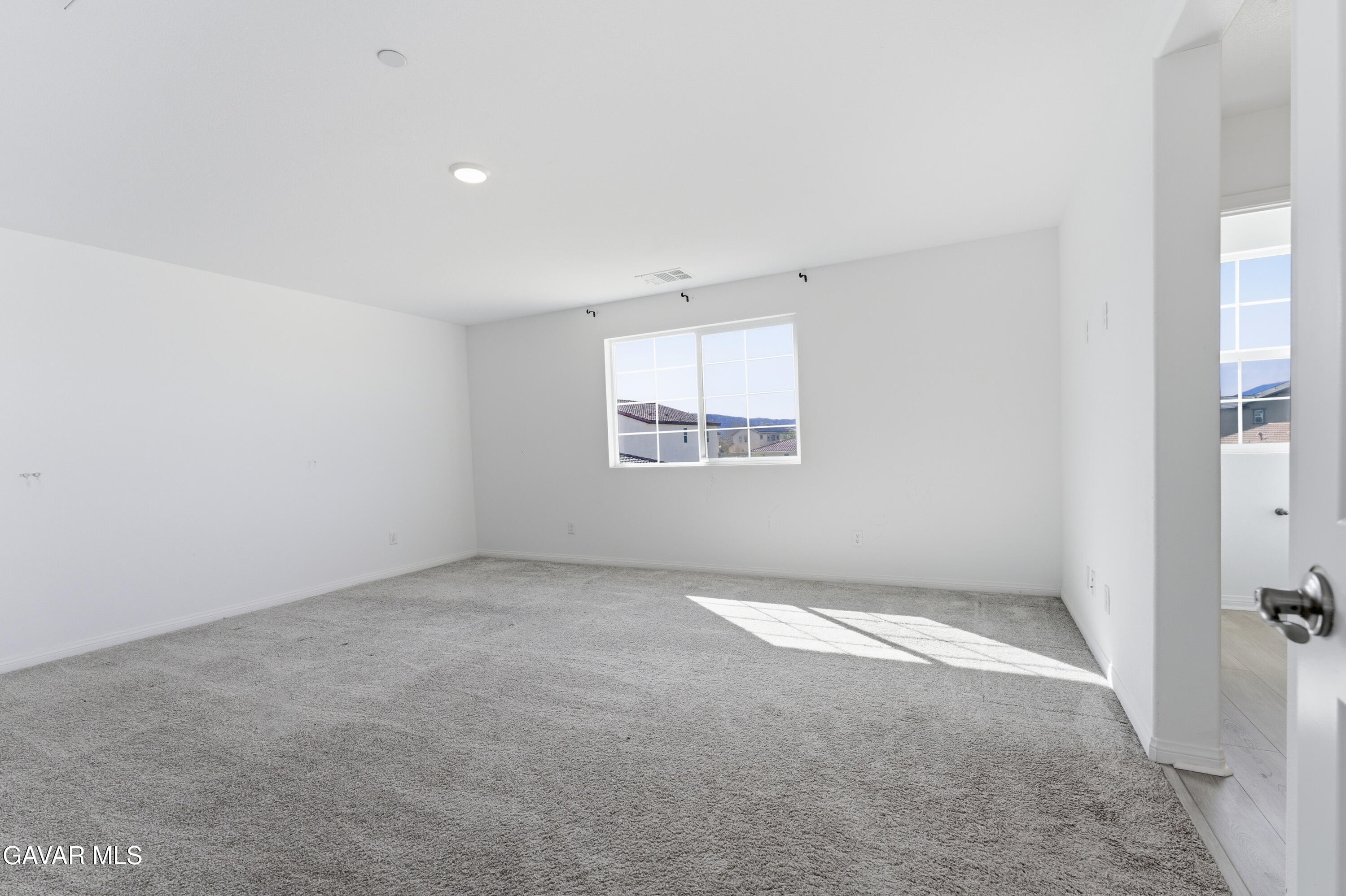 43869 Hampton Street Lancaster, CA 93536 - Photo 12 of 20 an empty room with windows