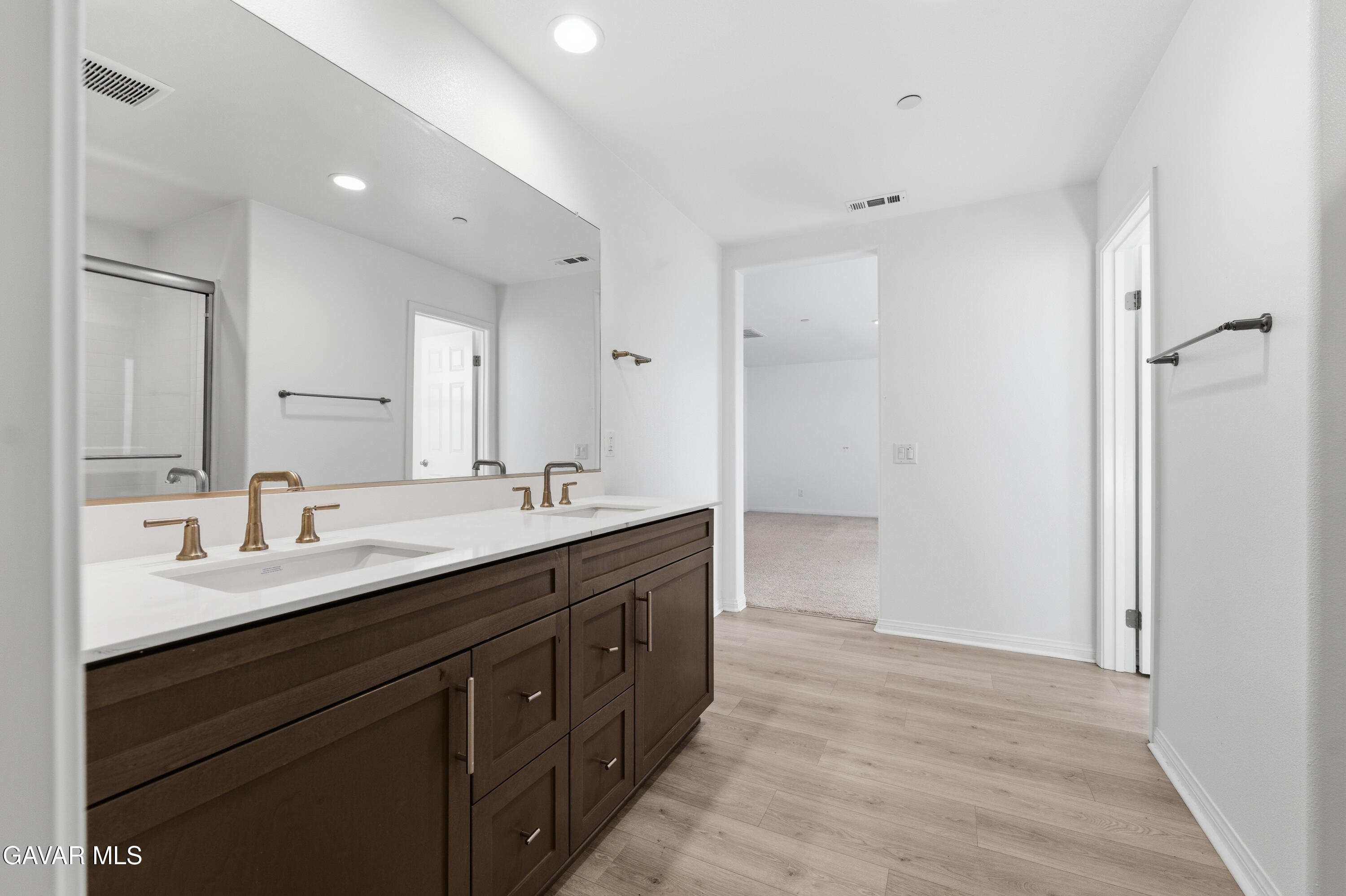 43869 Hampton Street Lancaster, CA 93536 - Photo 16 of 20 a spacious bathroom with a double vanity sink mirror double and shower