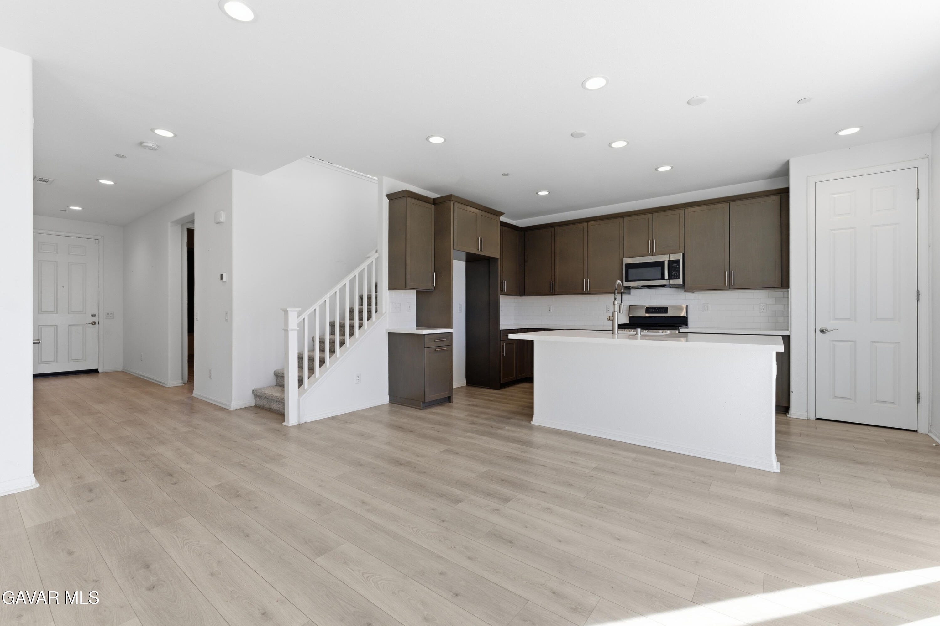 43869 Hampton Street Lancaster, CA 93536 - Photo 2 of 20 a view of kitchen with stainless steel appliances a refrigerator and a stove top oven