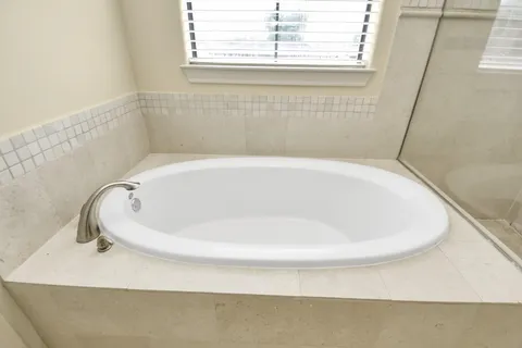 a white bath tub sitting in a bathroom