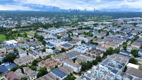 an aerial view of a city with lots of residential buildings