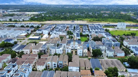 an aerial view of a city with lots of residential buildings