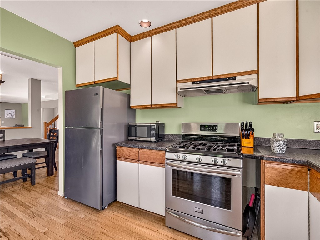 233 Dean Road Parma, NY 14559 - Photo 7 of 42 Kitchen includes newer stainless appliances.